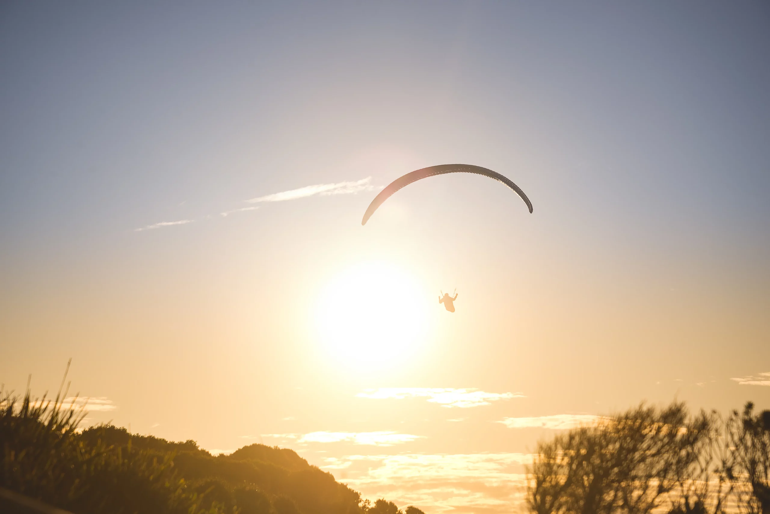 silhouette of paraglider flying over mountain at s 2021 08 31 09 43 35 utc